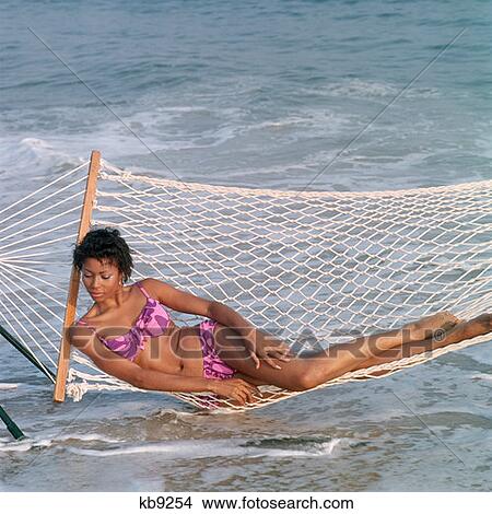 1970S African American Woman Lying In Hammock Beach View Large Photo Image Picture - 1970S African American Woman Lying In Hammock Beach. Fotosearch