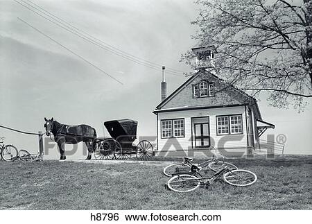 1970S Amish One-Room Schoolhouse At Top Of Hill Horse & Buggy & Bicycles Parked Outside View Large Photo Image Stock Photograph - 1970S Amish One-Room Schoolhouse At Top Of Hill Horse & Buggy & Bicycles Parked Outside . Fotosearch