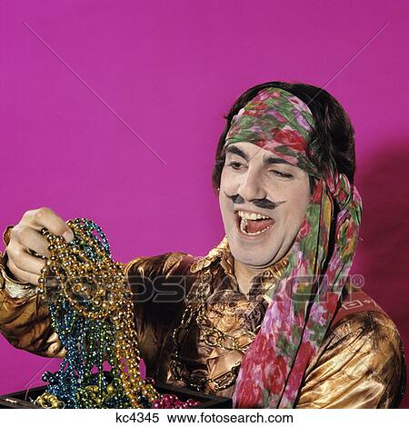 1970S Character Man Dressed As Pirate Costume Funny Expression Fake Moustache Holding Up Treasure Jewels Booty Laugh View Large Photo Image Stock Photography - 1970S Character Man Dressed As Pirate Costume Funny Expression Fake Moustache Holding Up Treasure Jewels Booty Laugh. Fotosearch