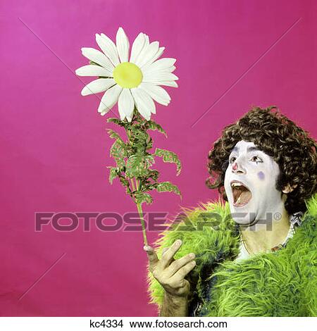 1970S Circus Clown Green Furry Jacket Great Big Giant Daisy Flower Prop View Large Photo Image Picture - 1970S Circus Clown Green Furry Jacket Great Big Giant Daisy Flower Prop. Fotosearch