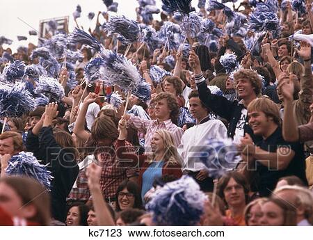 1970S Crowd College Students Football Game Waving Pom Poms Cheering Fans Beaver Stadium Pennsylvania View Large Photo Image Stock Image - 1970S Crowd College Students Football Game Waving Pom Poms Cheering Fans Beaver Stadium Pennsylvania . Fotosearch