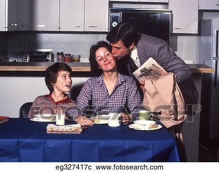 1970S Dad Kissing Mother On Cheek Surprised Boy At Breakfast Table View Large Photo Image Stock Image - 1970S Dad Kissing Mother On Cheek Surprised Boy At Breakfast Table. Fotosearch