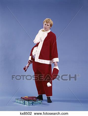 1970'S Exhausted Man Father Santa Claus Holding Hat And Beard Presents Costume Character Studio Indoor View Large Photo Image Stock Image - 1970'S Exhausted Man Father Santa Claus Holding Hat And Beard Presents Costume Character Studio Indoor. Fotosearch