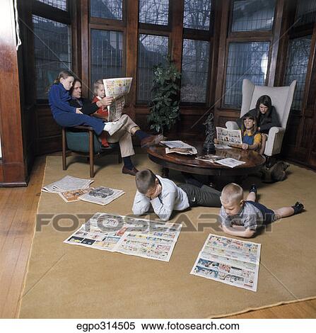 1970S Family Of 7 Reading Sunday Newspapers And Comics In Living Room View Large Photo Image Stock Photography - 1970S Family Of 7 Reading Sunday Newspapers And Comics In Living Room. Fotosearch