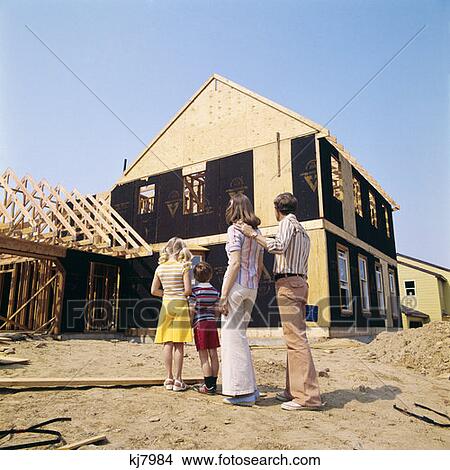 1970S Family Of Four Looking At New Home Under Construction Man Woman Boy Girl Building Story Plan View Large Photo Image Picture - 1970S Family Of Four Looking At New Home Under Construction Man Woman Boy Girl Building Story Plan . Fotosearch