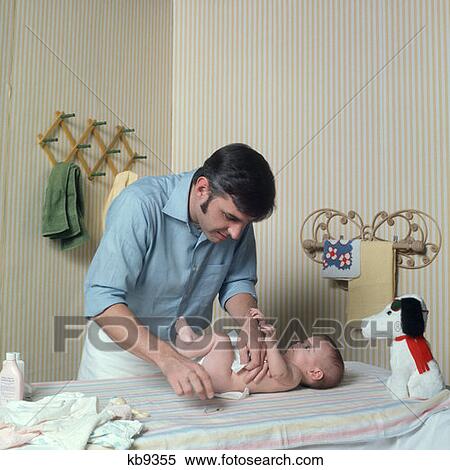 1970S Father Changing Baby'S Diaper On Changing Table View Large Photo Image Stock Photography - 1970S Father Changing Baby'S Diaper On Changing Table. Fotosearch