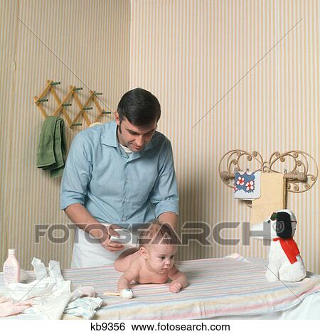 1970S Father Changing Baby'S Diaper View Large Photo Image Stock Photograph - 1970S Father Changing Baby'S Diaper. Fotosearch