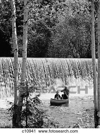 1970S Father & Son In Canoe In Front Of Waterfall With Father Rowing & Son Fishing View Large Photo Image Stock Image - 1970S Father & Son In Canoe In Front Of Waterfall With Father Rowing & Son Fishing . Fotosearch