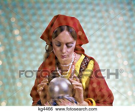 Stock Photograph - 1970S Gypsy Woman Looking Into Crystal Ball Fortuneteller Fortune Teller Prediction Future Retro . Fotosearch
