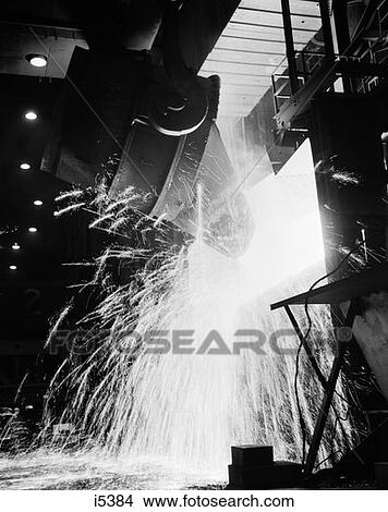 1970S Large Container Of Molten Material With Sparks Flying At Steel Plant View Large Photo Image Picture - 1970S Large Container Of Molten Material With Sparks Flying At Steel Plant . Fotosearch