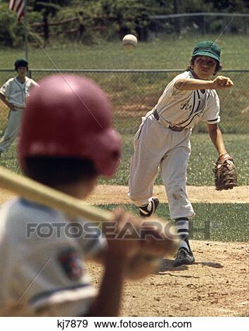 1970S Little League Baseball Game Boy Pitcher Throwing Ball To Batter View Large Photo Image Stock Photo - 1970S Little League Baseball Game Boy Pitcher Throwing Ball To Batter . Fotosearch