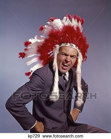 1970S Man In Native American Costume Headdress And Suit With Hands On Hips Symbolic Expression Executive View Large Photo Image Stock Photo - 1970S Man In Native American Costume Headdress And Suit With Hands On Hips Symbolic Expression Executive. Fotosearch