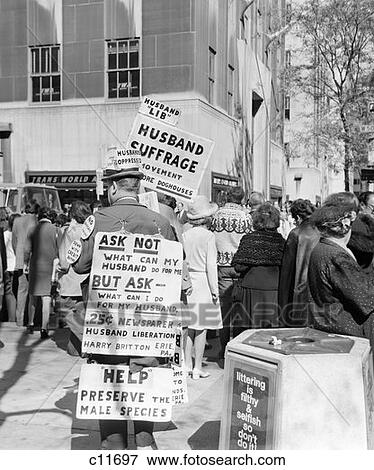 1970S Man On 5Th Avenue New York City Rockefeller Center Wearing Sandwich Board With Signs Advocating Husband Suffrage View Large Photo Image Stock Photo - 1970S Man On 5Th Avenue New York City Rockefeller Center Wearing Sandwich Board With Signs Advocating Husband Suffrage . Fotosearch
