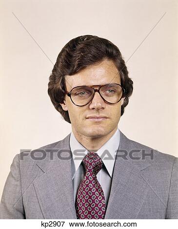 1970S Man Portrait Business Suit Serious Expression Aviator Eyeglasses Fashion Retro View Large Photo Image Stock Photo - 1970S Man Portrait Business Suit Serious Expression Aviator Eyeglasses Fashion Retro . Fotosearch