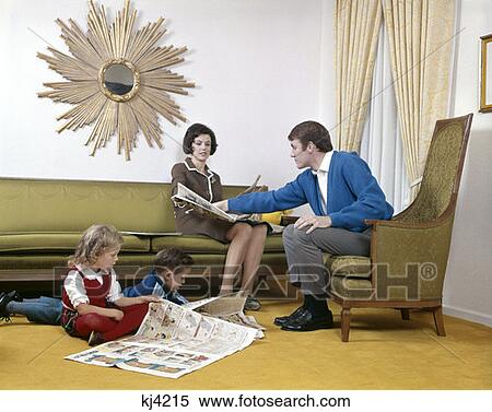 1970S Mother And Father Reading Sunday Paper With Son And Daughter In Living Room Sunburst Mirror Man Woman Boy Girl View Large Photo Image Stock Photography - 1970S Mother And Father Reading Sunday Paper With Son And Daughter In Living Room Sunburst Mirror Man Woman Boy Girl. Fotosearch
