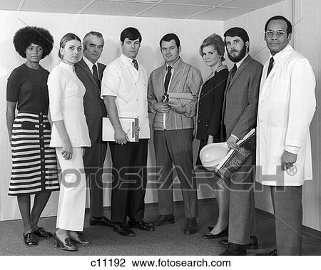 Stock Image - 1970S Multi-Ethnic Line-Up Of Men & Women Of Various Professions With Serious Expressions . Fotosearch