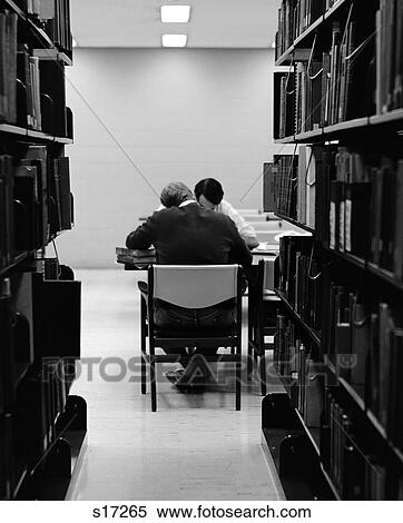 1970S Pair Of Male College Students Studying In Library Framed By Bookshelves View Large Photo Image Stock Photography - 1970S Pair Of Male College Students Studying In Library Framed By Bookshelves . Fotosearch