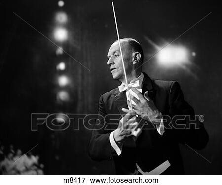 1970S Portrait Of Older Man In Tails Conducting In Music Hall View Large Photo Image Stock Photo - 1970S Portrait Of Older Man In Tails Conducting In Music Hall . Fotosearch