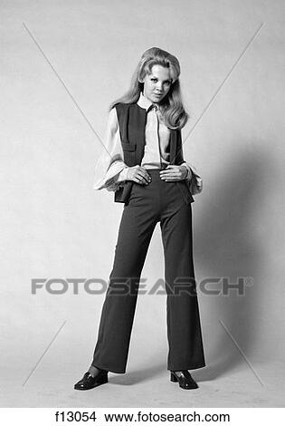 1970S Portrait Woman With Long Blond Hair Wearing Flared Pantsuit With Vest View Large Photo Image Picture - 1970S Portrait Woman With Long Blond Hair Wearing Flared Pantsuit With Vest . Fotosearch