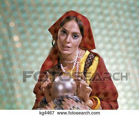 1970S Retro Gypsy Woman Fortuneteller Fortune Teller Hands Over Crystal Ball Prediction Future  View Large Photo Image Stock Photo - 1970S Retro Gypsy Woman Fortuneteller Fortune Teller Hands Over Crystal Ball Prediction Future . Fotosearch