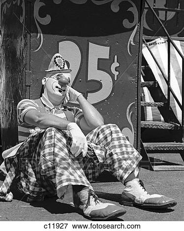 1970S Sad Clown Seated Resting Cheek On Hand Leaning On Booth Reading 25 Cents View Large Photo Image Stock Photo - 1970S Sad Clown Seated Resting Cheek On Hand Leaning On Booth Reading 25 Cents . Fotosearch