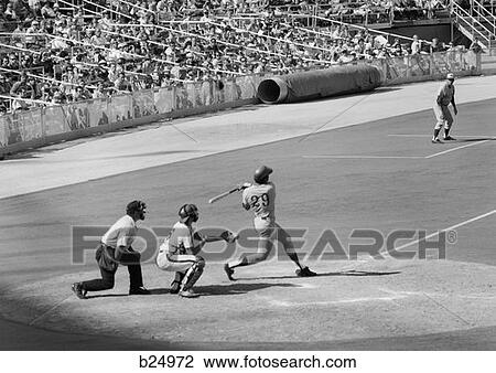 1970S Side View Of Batter Completing Swing With Catcher & Umpire Behind Him At Professional Baseball Game View Large Photo Image Stock Image - 1970S Side View Of Batter Completing Swing With Catcher & Umpire Behind Him At Professional Baseball Game . Fotosearch
