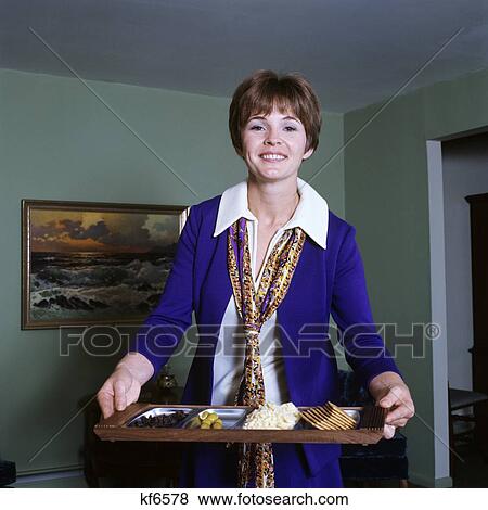 1970S Smiling Woman Hostess Holding Tray Cheese Crackers Snacks View Large Photo Image Stock Photo - 1970S Smiling Woman Hostess Holding Tray Cheese Crackers Snacks . Fotosearch