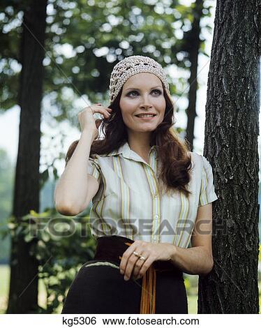 Stock Photograph - 1970S Smiling Woman Portrait Outdoor Wear Crochet Cap Brunette Long Hair . Fotosearch