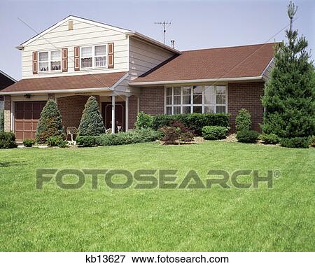 1970S Split Level Suburban Home Bay Window Manicured Lawn Landscaping View Large Photo Image Stock Photo - 1970S Split Level Suburban Home Bay Window Manicured Lawn Landscaping. Fotosearch