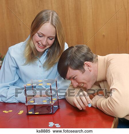 1970S Teen Couple Boy Girl Playing Game Of Futuristic Checkers On 4 Levels Smile Date Board Game Fun Together View Large Photo Image Stock Photography - 1970S Teen Couple Boy Girl Playing Game Of Futuristic Checkers On 4 Levels Smile Date Board Game Fun Together. Fotosearch