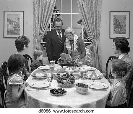1970S Three Generation Family Around Dining Room Table With Grandmother Serving A Ham View Large Photo Image Stock Photograph - 1970S Three Generation Family Around Dining Room Table With Grandmother Serving A Ham . Fotosearch