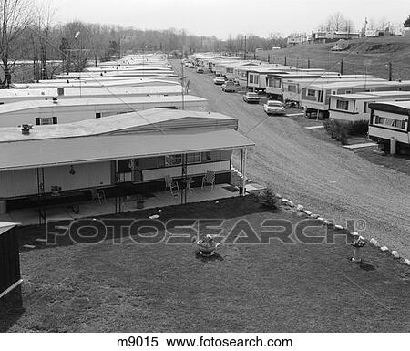 1970S Trailer Park With Rows Of Mobile Homes On Either Side Of Gravel Road View Large Photo Image Stock Photography - 1970S Trailer Park With Rows Of Mobile Homes On Either Side Of Gravel Road . Fotosearch