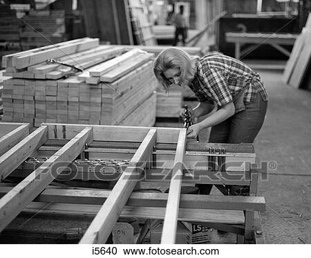 1970S Woman Joining Boards With Nailgun In Pre-Fab Home Factory View Large Photo Image Stock Image - 1970S Woman Joining Boards With Nailgun In Pre-Fab Home Factory . Fotosearch
