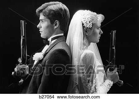 1980S Bride And Groom Back To Back Holding Dueling Pistols View Large Photo Image Picture - 1980S Bride And Groom Back To Back Holding Dueling Pistols. Fotosearch