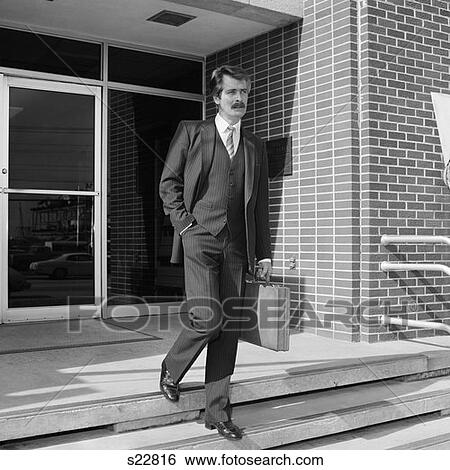 1980S Businessman In Pinstripe Suit Walking Out Of Building Down Stairs Carrying Briefcase  View Large Photo Image Stock Photograph - 1980S Businessman In Pinstripe Suit Walking Out Of Building Down Stairs Carrying Briefcase . Fotosearch