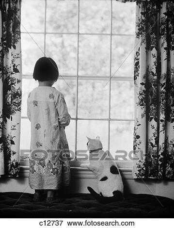 1980S Little Girl In Printed Nightgown & Her Pet Cat Standing And Looking Out Window View Large Photo Image Stock Photo - 1980S Little Girl In Printed Nightgown & Her Pet Cat Standing And Looking Out Window . Fotosearch