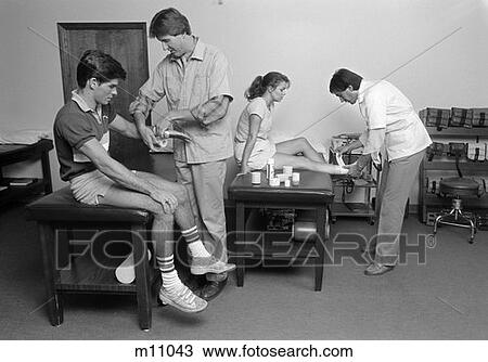 1980S Medical Office Teen Boy Having Wrist Bandaged & Teen Girl Having Ankle Bandaged View Large Photo Image Stock Image - 1980S Medical Office Teen Boy Having Wrist Bandaged & Teen Girl Having Ankle Bandaged . Fotosearch