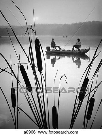 1980S Two Men Bass Fishing Boat Lake Cattails Grass In Foreground View Large Photo Image Stock Photograph - 1980S Two Men Bass Fishing Boat Lake Cattails Grass In Foreground . Fotosearch