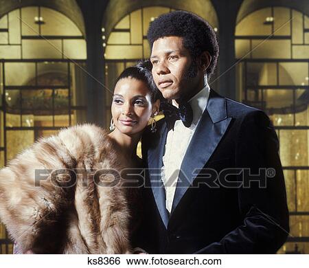 African American Couple Man Woman Fur Coat Tuxedo Portrait 1973 1970S Retro View Large Photo Image Stock Photograph - African American Couple Man Woman Fur Coat Tuxedo Portrait 1973 1970S Retro. Fotosearch