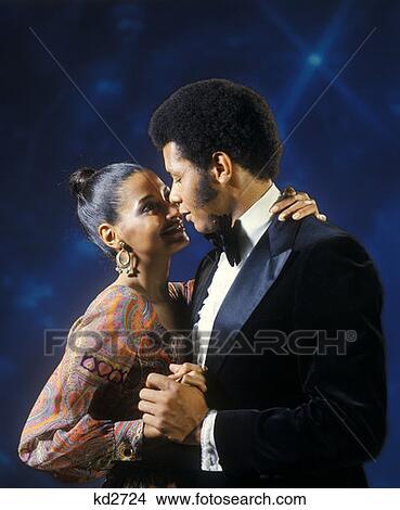 Picture - African American Couple Man Woman Dancing Embrace Embracing Tuxedo 1970 1970S Retro . Fotosearch