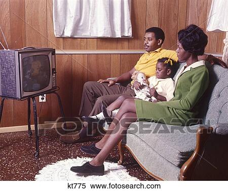 African American Family Father Mother Daughter Watching Television 1970 1970S Retro View Large Photo Image Stock Photography - African American Family Father Mother Daughter Watching Television 1970 1970S Retro. Fotosearch