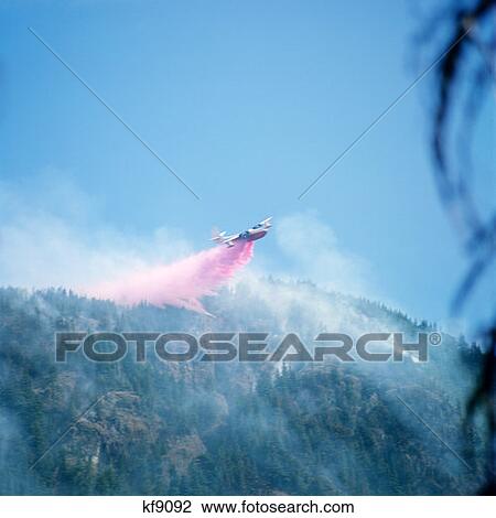 Airplane Dropping Water Over Forest Fire View Large Photo Image Stock Image - Airplane Dropping Water Over Forest Fire. Fotosearch