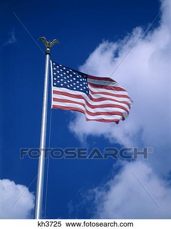 Stock Photography - American Flag On Pole With Gold Eagle. Fotosearch