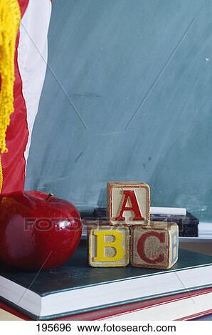 Stock Photograph - Apple Books Blocks Near Chalkboard. Fotosearch