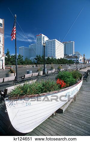 Stock Image - Atlantic City Nj Rowboat Planter On Boardwalk By Resorts And Taj Mahal Hotels And Casinos . Fotosearch