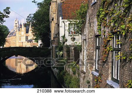 Stock Photo - Bruges Belgium View Down Canal Toward Bridge . Fotosearch