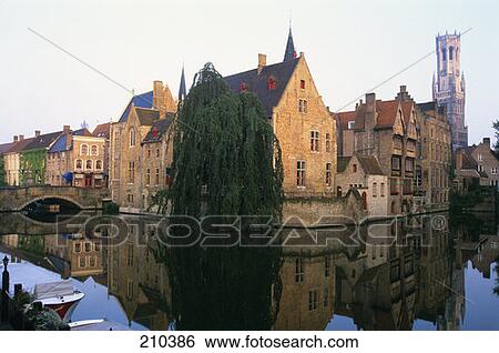 Stock Photograph - Bruges Belgium View Of Boats On Canal And The Belfry . Fotosearch