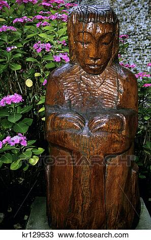 Stock Image - Bruges Belgium Wooden Sculpture The Lace Maker . Fotosearch