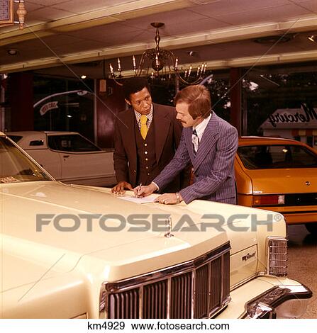 Stock Photo - Car Salesman Trying Sell White Car Black African American Buyer 1970 1970S Retro . Fotosearch