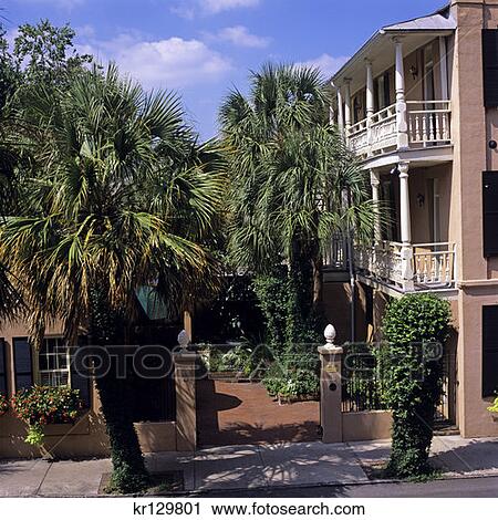 Stock Image - Charleston Sc Pink Home With Palm Trees In Historical District . Fotosearch